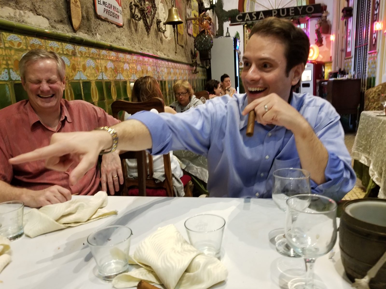 LNE Group team members laughing at dinner