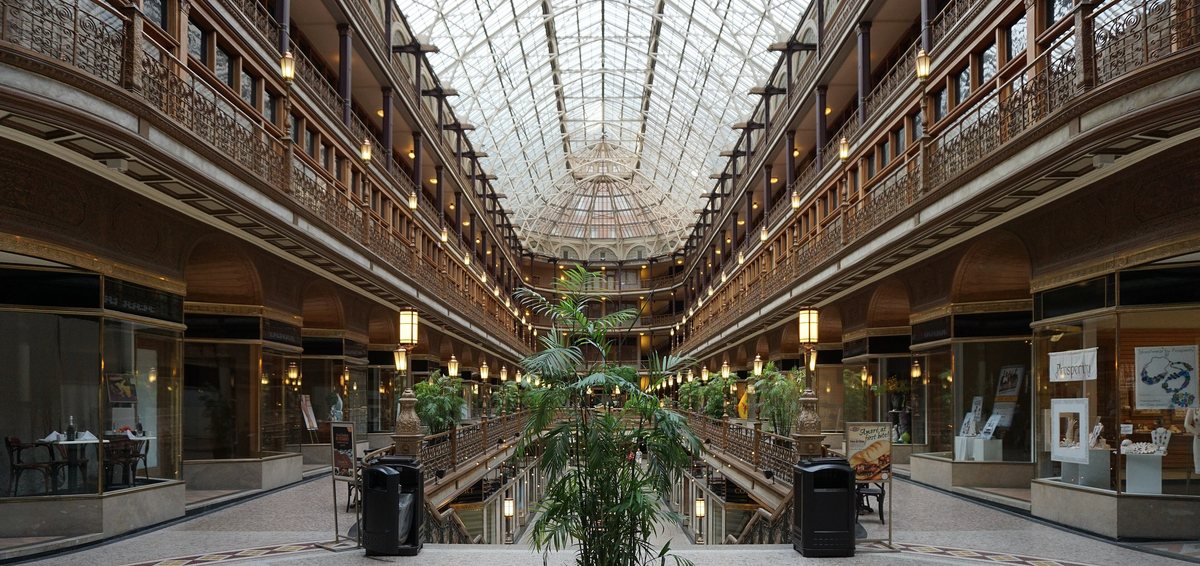 A historic commercial arcade with a glass skylight